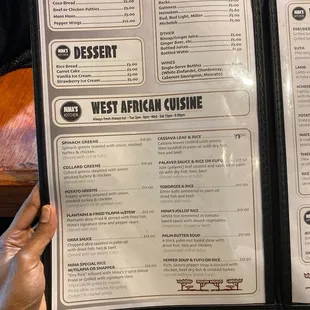 a person holding a menu