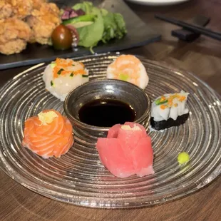 Karaage in the background, sashimi platter arranged as flowers
