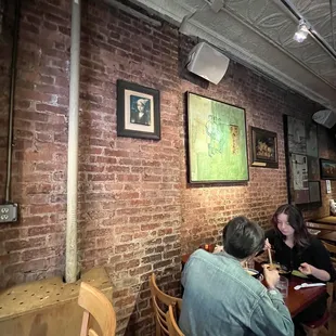 a group of people eating at a restaurant