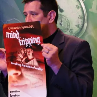 a man holding up a book