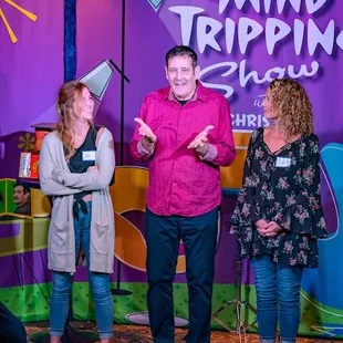 three people on stage