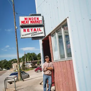 a man leaning against a building