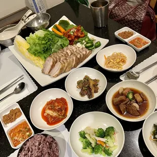 a variety of dishes of food on a table