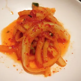 a plate of pasta with tomato sauce