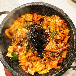 Octopus Hot-Stone Bibimbap is a must. The sizzling stone pot, tender octopus, and perfectly mixed rice