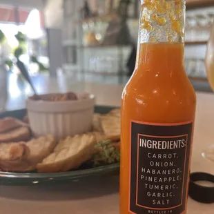 Spicy hummus plate and fermented hot sauce.