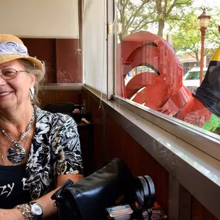 My Aunt Barbie behind the restaurant&apos;s mascot.
