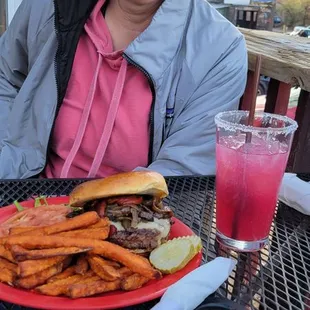 Prickly pear margarita and burger with sweet potato fries.