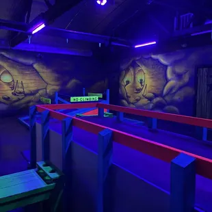 a brightly lit room with benches