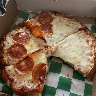 a pepperoni pizza in a box
