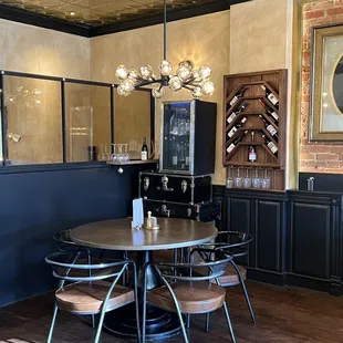 a dining room with a table and chairs