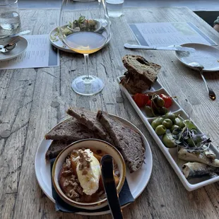 Quark with warm peaches and pecans, served with a nutty bread, alongside the tinned fish with sweet peppers, olives and caper berries.