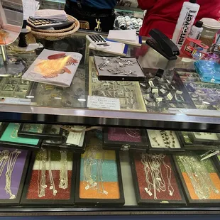 Shop&apos;s chains, pendants, earrings, and rings