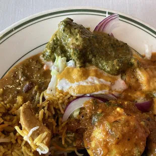 a plate of food with rice and meat