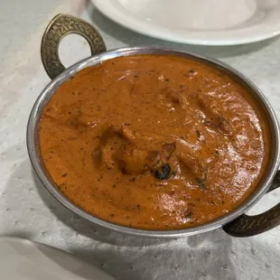 a bowl of curry and a plate of rice