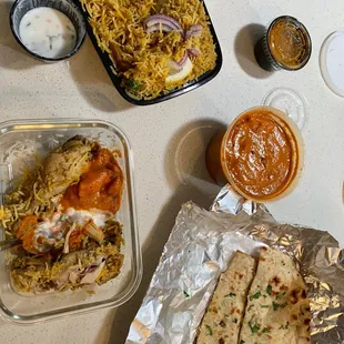 Chicken Dum Biryani(chicken is under the bed of rice , chicken Paneer Butter Masala (Makhani) ; and garlic naans