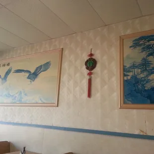 two paintings on the wall