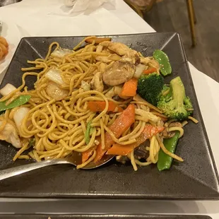 a plate of noodles and vegetables