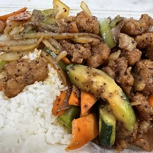 L26. Black Pepper Chicken - dry stir-fry (no sauce). Mildly spicy from the black pepper with onions, bell peppers, carrots, and zucchini.