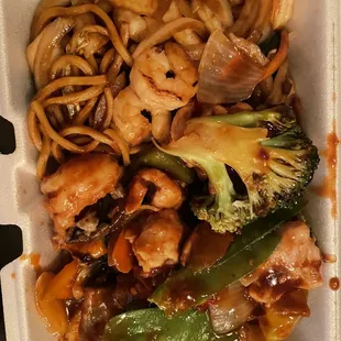 chinese food in a styrofoam container