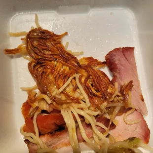 a meat and cheese sandwich with pickles