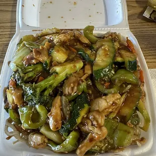 Spicy chicken over pan fried noodles