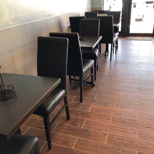 empty tables and chairs in a restaurant