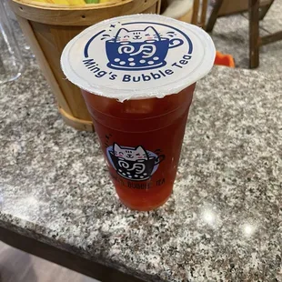 An açaí berry and passion fruit green tea. The boba I had in there were the cherry blossom boba.