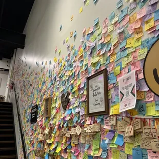 a wall covered with post it notes