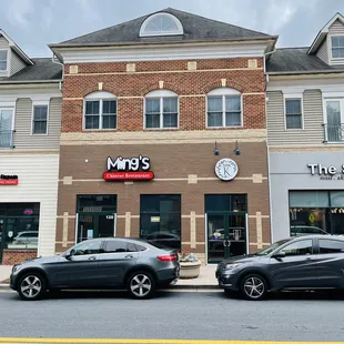 cars parked in front of it