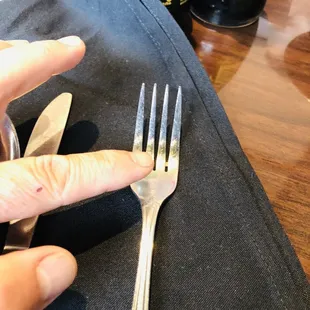 a fork and knife on a napkin