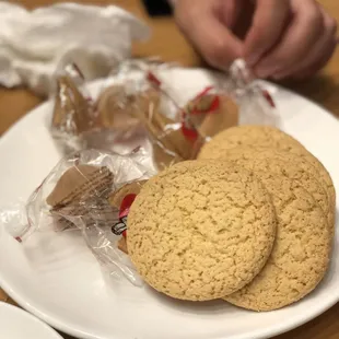 Complementary fortune cookie and almond cookie