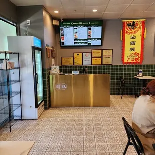 a man sitting at a table in a restaurant
