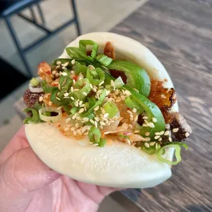 Up close look at a bulgogi bun with cheese