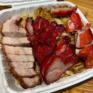 pork and noodles in a styrofoam container