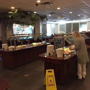 a woman serving food in a restaurant