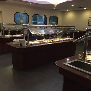 a buffet area with a variety of food items
