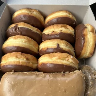 Chocolate , maple , and a blueberry donut
