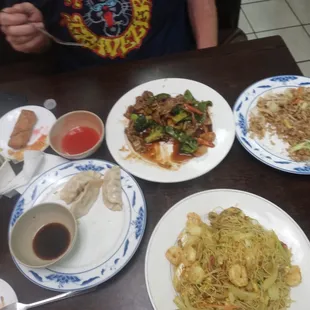 Szechuan beef vegetable fried rice egg rolls thin fried potstickers and Singapore rice noodles