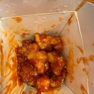 Sesame chicken. Pretty sure it's sweet and sour sauce with sesames