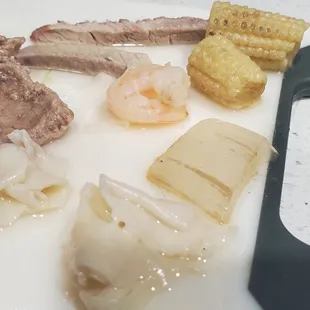 Rotten veggies, questionable meat, gray tiny shrimp, and the two wonton with no filling in the entire Wor Won Ton soup.