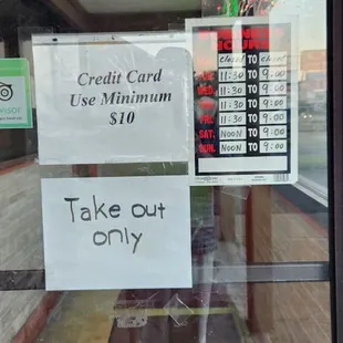 No Dine In / Hours / Credit Card / No Smoking Signs.