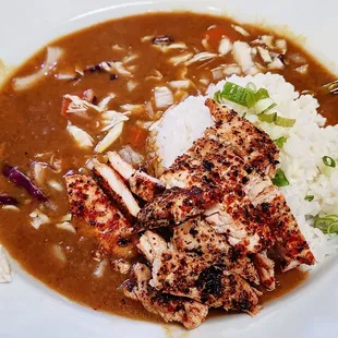 a plate of food with rice and meat