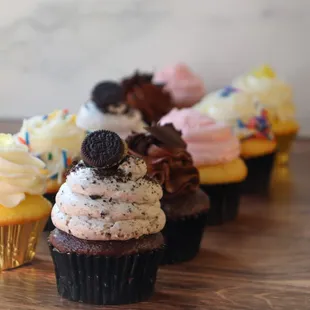 a row of cupcakes on a table