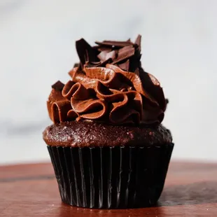 a chocolate cupcake with chocolate frosting