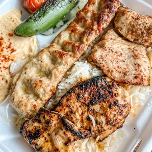 Combo plate: chicken lule kabob, pork tenderloin kabob and chicken thigh kabob.