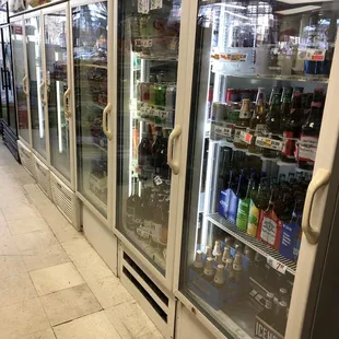 a row of refrigerators in a store