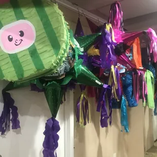 colorful pinatas hanging from the ceiling