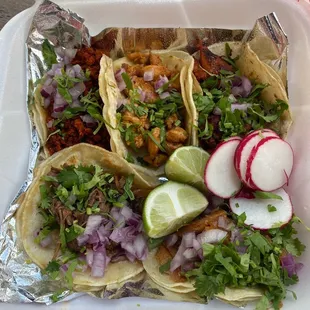 Tour of tacos: Chorizo, Pollo, Al Pastor, Carnitas and Barbacoa (from top left)
