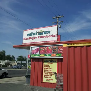 a red building with a sign on it